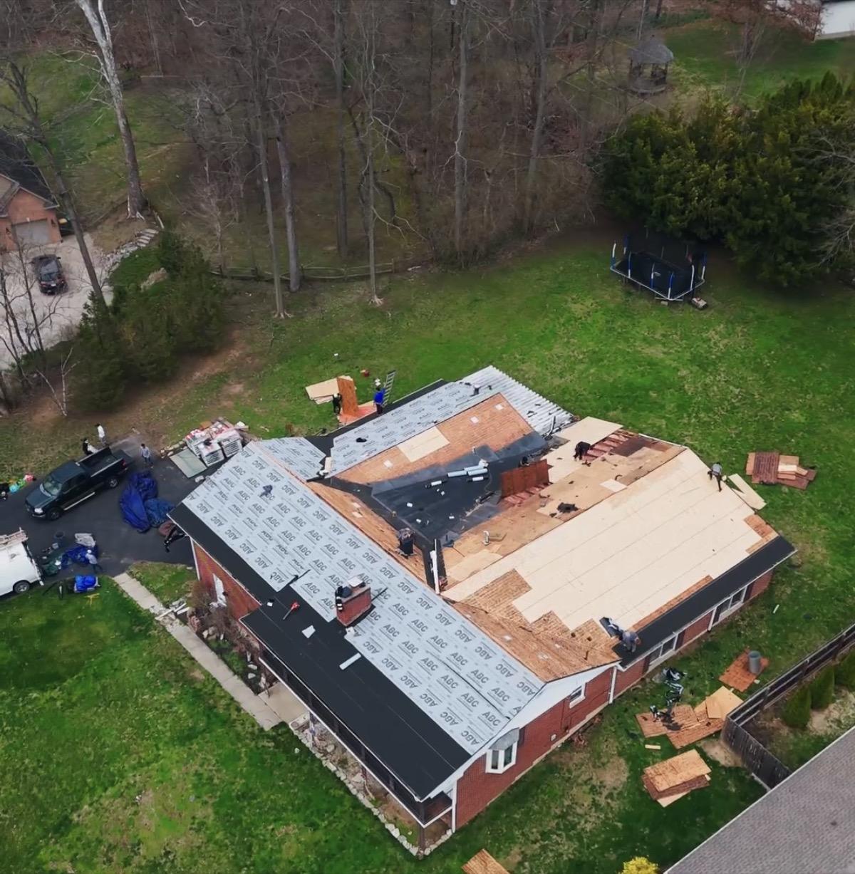 Roof repair in progress after storm damage