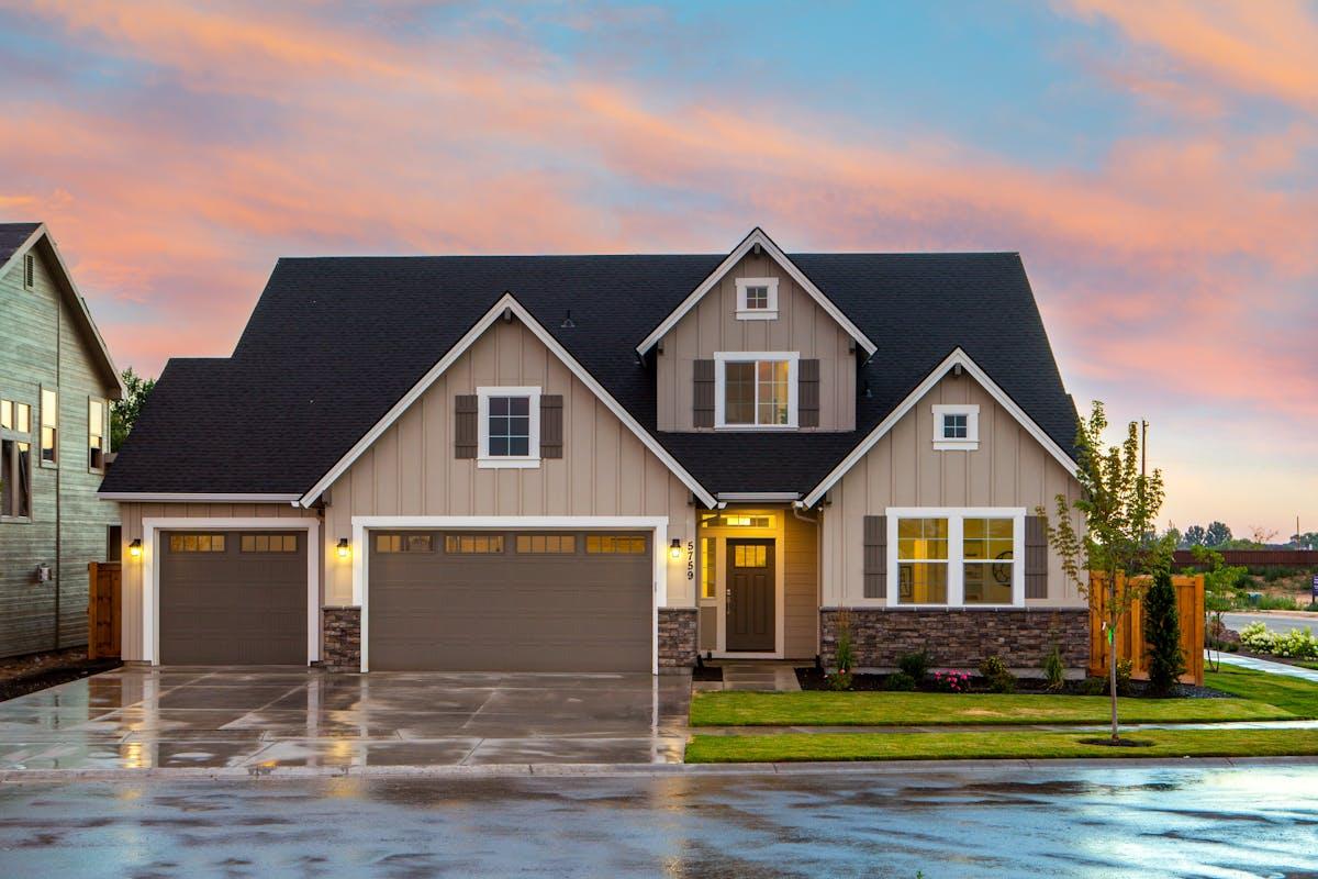 Modern farmhouse exterior with premium siding at sunset